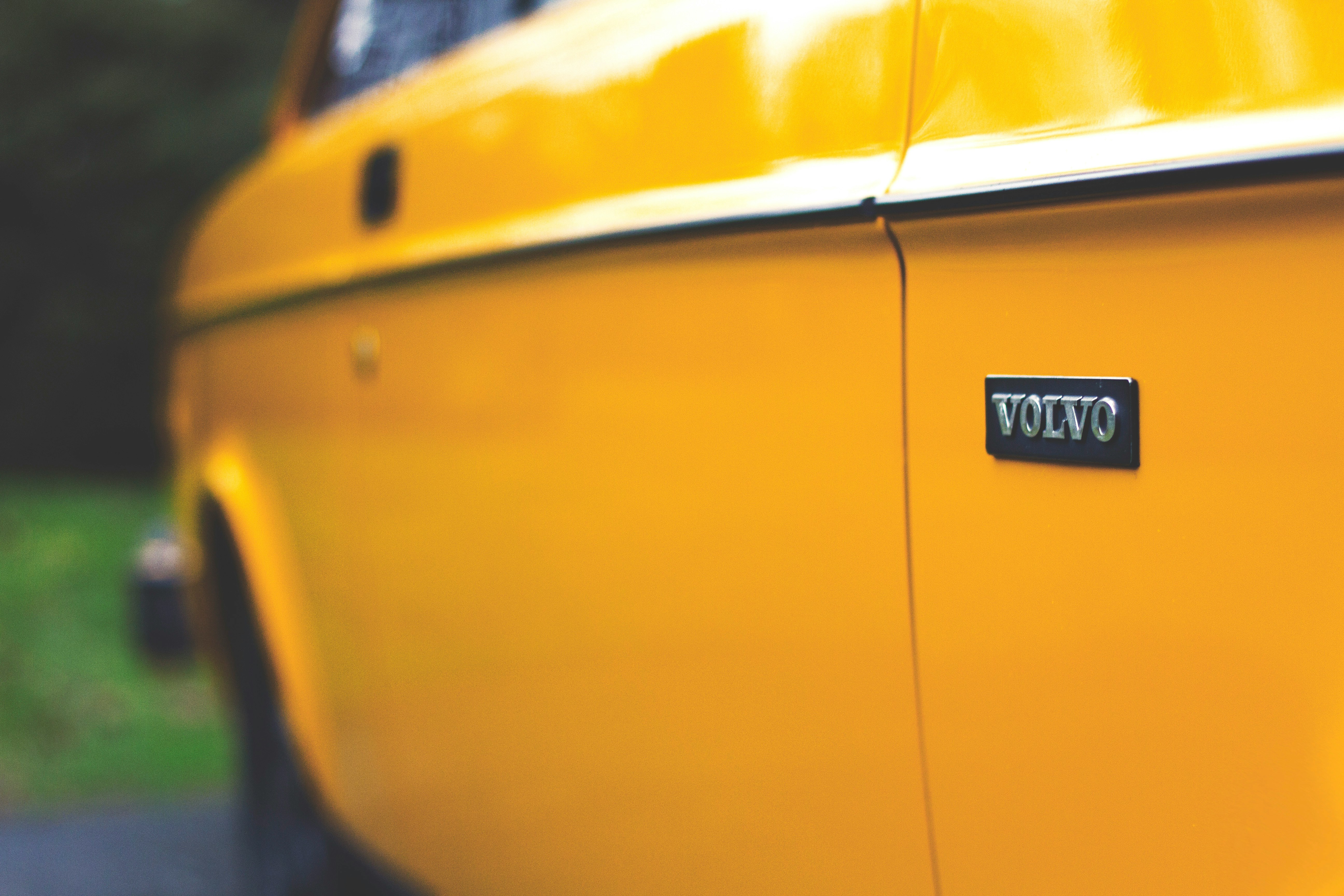 close up photography of yellow Volvo car